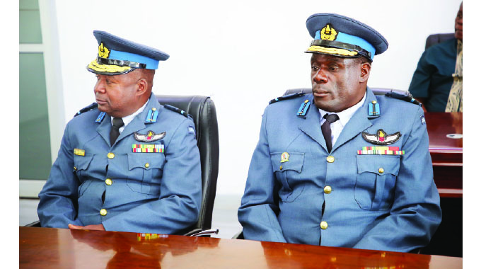 The newly promoted Air Commodores Maxwell Sakupwanya (left) and Ernest Matsambira