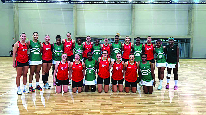 SPIRIT OF FRIENDSHIP . . . Zimbabwe’s netball team players pose for a picture with the Wales netball team after yesterday’s Netball World Cup warm-up match in Cape Town, South Africa