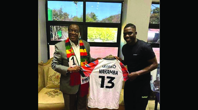 THIS ONE FOR KEEPS . . . President Mnangagwa (left) receives a replica jersey from Zimbabwe international Marvelous Nakamba after the midfielder, who is currently off-season, paid a courtesy call on the Head of State yesterday.