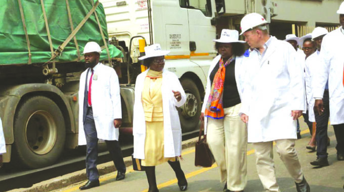 Minister of Industry and Commerce Dr Sithembiso Nyoni (second from left) shares insights with Secretary for Industry and Commerce Dr Mavis Sibanda (centre) and National Foods chief executive officer Michael Lashbrook (right) during a tour of the manufacturing company on Wednesday.
