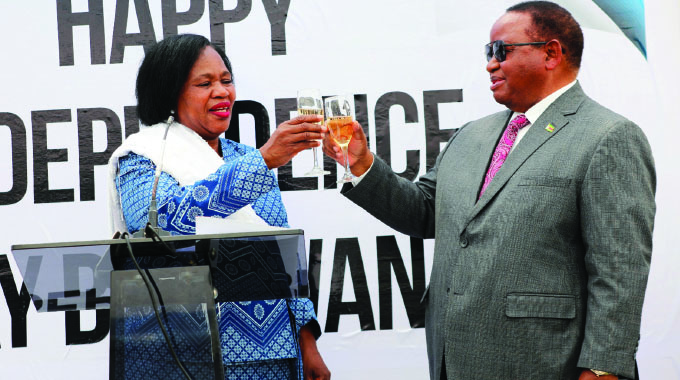 Minister of Foreign Affairs and International Trade Frederick Shava toasts with Botswana’s Ambassador to Zimbabwe Mrs Sarah Molosiwa at the neighbouring country’s National Day celebrations in Harare yesterday