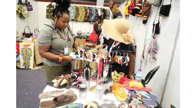 Mhlelusizo Ncube (left) admires beadwork at a Women in Tourism stand during last year’s Sanganai\Hlanganani Expo (File picture)