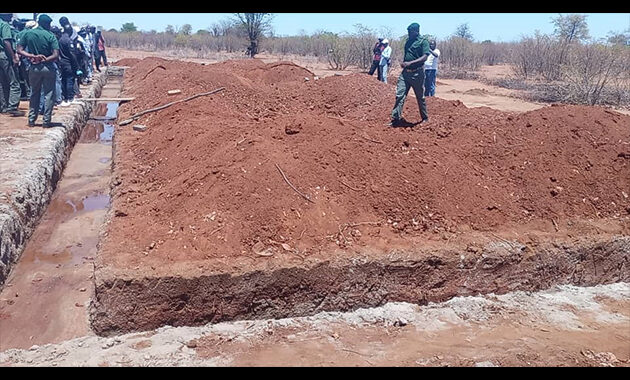 Personnel from the Zimbabwe Prisons and Correctional Service at the site of Sabasi Primary School