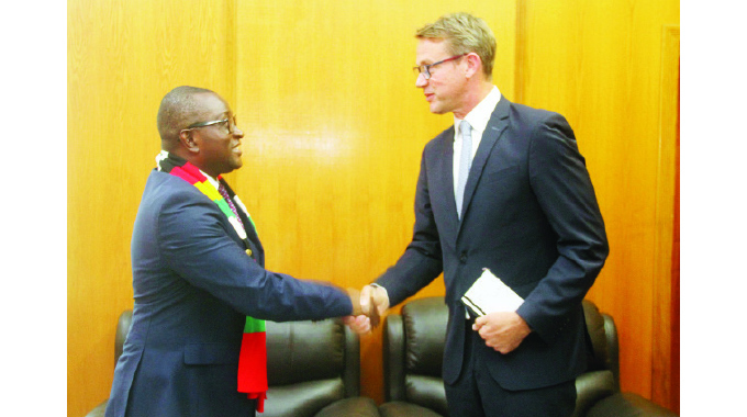 Information, Publicity and Broadcasting Services Minister Dr Jenfan Muswere (left) welcomes British Ambassador to Zimbabwe Mr Peter Vowles at his offices in Harare yesterday.