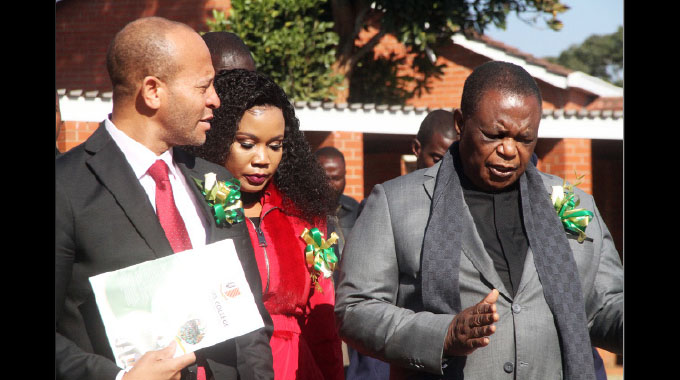 Vice President Dr Constantino Chiwenga chats with St Ignatius College Chairman of the Board of Governors Tafadzwa Chinamo (left) while flanked by his wife Colonel Miniyothabo Chiwenga (centre) in Chishawasha yesterday.
