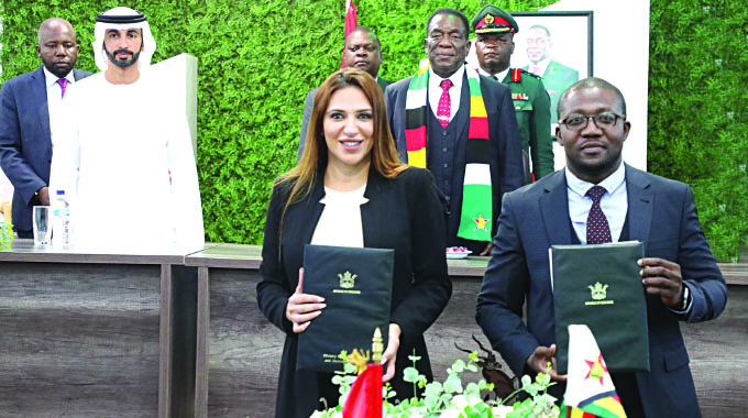 President Mnangagwa and His Highness Sheikh Ahmed Dalmook Al Maktoum witness the signing of carbon credits trading conservation agreement between Blue Carbon General Trading, represented by Chief Executive Officer Josiane Sadaka (left), and Environment, Climate and Wildlife Minister Mangaliso Ndlovu in Harare yesterday.