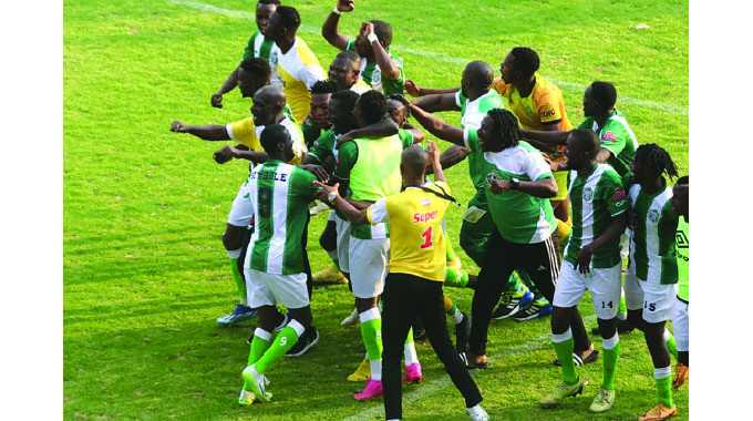 CAPS United players celebrate a penalty shootout victory over Highlanders at Barbourfields yesterday.