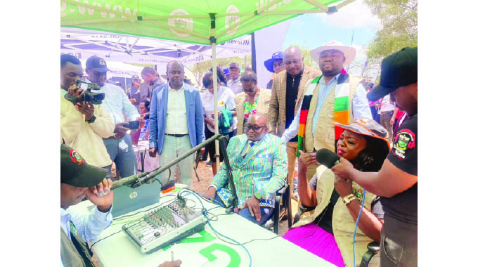 ICT, Postal and Courier Services Minister Tatenda Mavetera and Information, Publicity and Broadcasting Services Minister Dr Jenfan Muswere being interviewed by the Great Zimbabwe University Campus Radio during joint celebrations to mark World Post Day and International Day for Universal Access to Information at Chivi Growth Point yesterday.