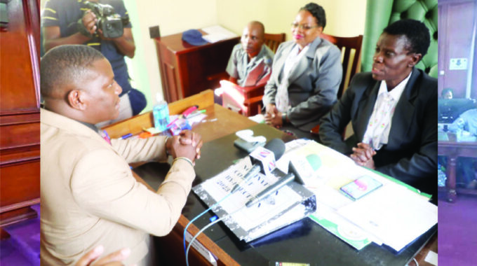 Recalled CCC candidate for Cowdray Park constituency Mr Pashor Sibanda listens to the Nomination court officer Mavis Mudiwakure during submission of nomination papers in Bulawayo yesterday.