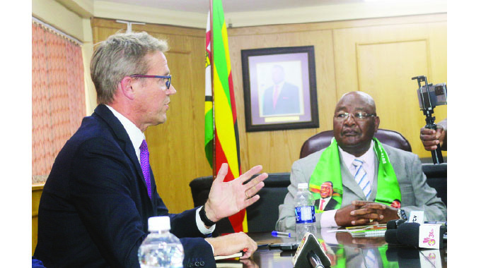 Zanu PF Secretary-General Cde Obert Mpofu (left) and British Ambassador to Zimbabwe Mr Peter Vowles during a courtesy call in Harare yesterday.- Picture: Charles Muchakagara.
