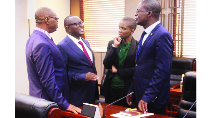 Information, Publicity and Broadcasting Services Minister Dr Jenfan Muswere (second from left) interacts with Health and Child Care Minister Dr Douglas Mombeshora (left), Tourism and Hospitality Industry Minister Barbara Rwodzi (second from right) and Higher and Tertiary Education, Innovation, Science, and Technology Development Minister Professor Amon Murwira at the post-Cabinet briefing in Harare yesterday.