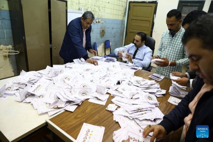 Staff members count ballots following the conclusion of the voting in Egypt's presidential election at a polling station in Cairo, Egypt, on Dec. 12, 2023. Egypt concluded on Tuesday the three-day voting in the presidential election as the vote-counting process started immediately, according to the National Election Authority (NEA). (Xinhua/Ahmed Gomaa)