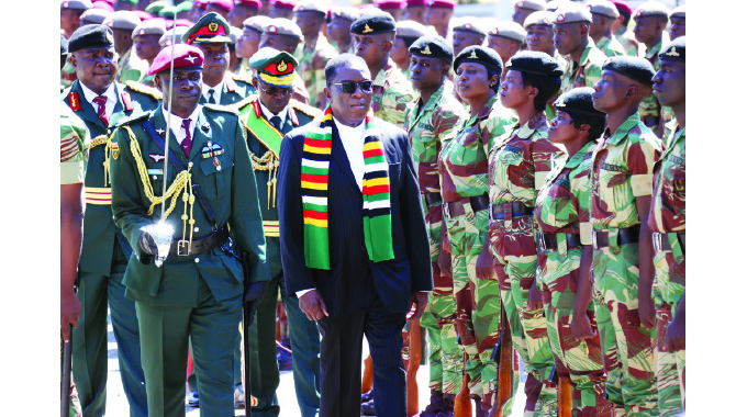 Commander-in-Chief of the Zimbabwe Defence Forces President Mnangagwa inspects a parade at the Commissioning of the Regular Officer Cadet Course 3/39/22 at the Zimbabwe Military Academy in Gweru on Friday.