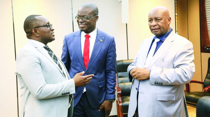 Information, Publicity and Broadcasting Services Minister Dr Jenfan Muswere (left) chats with Higher and Tertiary Education, Innovation, Science and Technology Development Minister, Professor Amon Murwira (centre) and Energy and Power Development Minister Edgar Moyo just before a post-Cabinet press briefing at Munhumutapa offices in Harare yesterday.